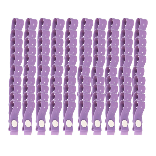 Purple latex free disposable tourniquet strap with stud fastener for medical use.