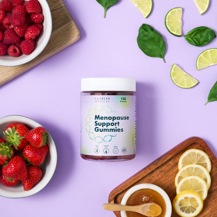Jar of Menopause Support Gummies with fruits and herbs on a lavender background