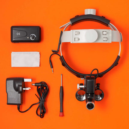 Optical loupes inside lightweight aluminium case for secure transport