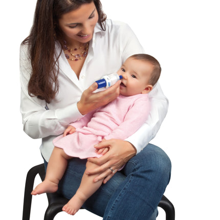 Mother using Rhino Clear Nasal Aspirator to help baby breathe easier.
