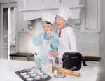 Family baking in kitchen with iGo2 Portable Oxygen Concentrator on counter