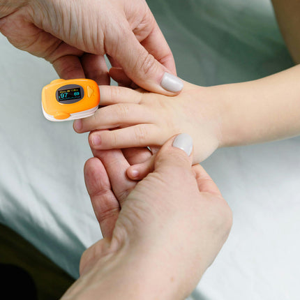Orange pulse Oximeter and nasal aspirator for children 