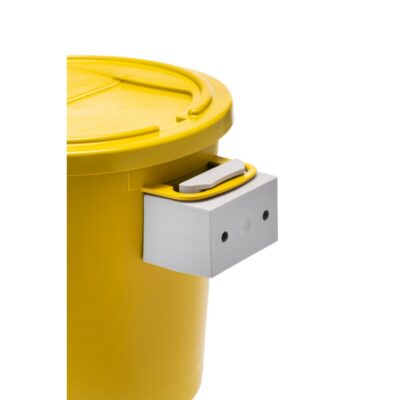A close-up of a yellow plastic container with a lid and a white metal latch mechanism attached to the side.