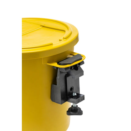 A close-up of a yellow plastic container with a black adjustable clamp or mount attached to the side, shown against a plain white background.